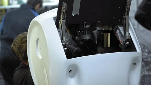 Disassembled robot in production. The engineer assembles and repairs the body of Stock Footage 101548909