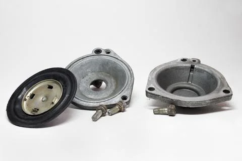 Disassembled vacuum opening drive of second chamber of carburetor. diaphrag.. Stock Photos