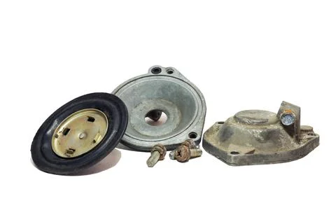 Disassembled vacuum opening drive of second chamber of carburetor. diaphrag.. Stock Photos