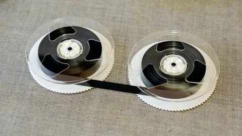 Disassembled VHS cassette components in the background Stockfoto's