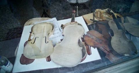 Disassembled Violins on Display in Shopfront Window Stock Footage 203971288