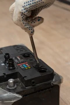 Disassembling the car battery for checking the electrolyte density Stock Photos