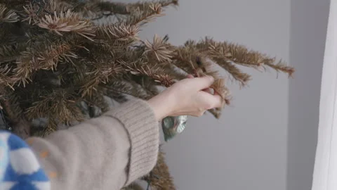 Disassembling Christmas tree decorations, winter holidays ending concept Stock Footage 332908440