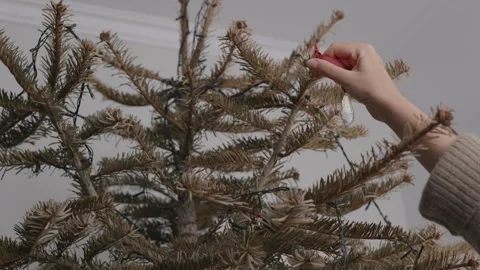 Disassembling Christmas tree decorations, winter holidays ending concept Vídeo Stock 332908542
