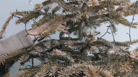 Disassembling Christmas tree decorations, winter holidays ending concept Stock Footage 332908557