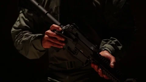 Disassembling a gun Video stock 76940561