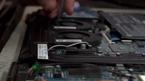 Disassembling a laptop in a service center Stock Footage 142375377