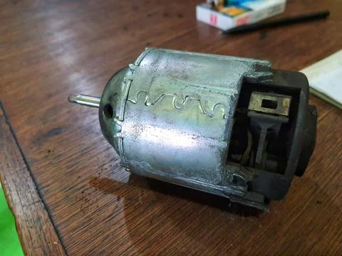 Disassembly of a car air conditioner component, namely the blower engine. Thi 스톡 사진