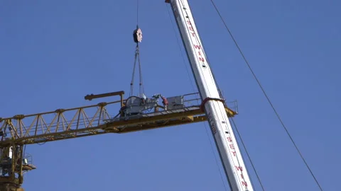 Disassembly of part of crane on construction site Stock Footage 145793484