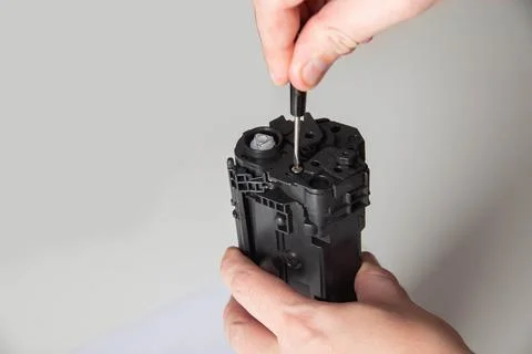 Disassembly of the printer cartridge for its maintenance and refilling with Stock Photos