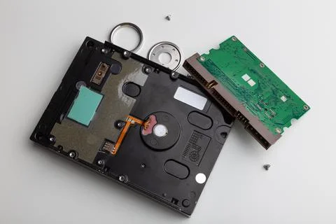 Disassembly process of an external hard drive in details Stock Photos