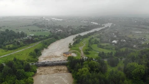 Disaster. Cataclysm. Catastrophe.Fast flowing raging river. Stock Footage 133450466