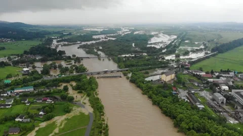 Disaster. Cataclysm. Catastrophe.Fast flowing raging river.Swollen boiling Stock Footage 133455551