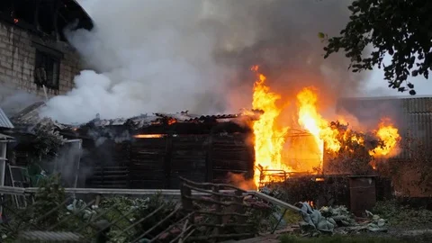Disaster. A firefighter works on a fire. Fire in a private house Stock Footage 80838663