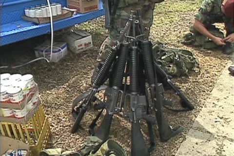 Disaster, M-16 rifle stack tilt up to Airborne Troop, Hurricane Andrew damage Stock Footage 25827464