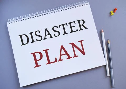 Disaster Plan text written in Notebook. Concept meaning Respond to Emergency Stock Photos