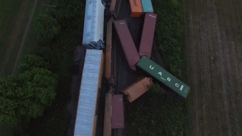 Disaster viewed from the air after train derails leaving multiple cars toppled - Video stock 104075228