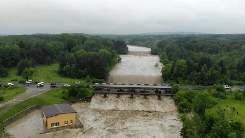 Disaster.Breakthrough of the dam.Catastrophe.Fast flowing raging river. Stock Footage 133449309