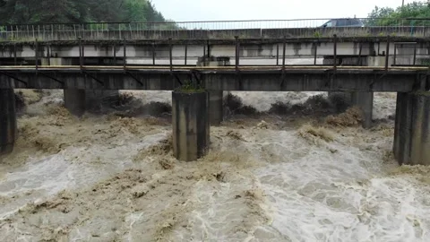 Disaster.Breakthrough of the dam.Dirty water.Swollen boiling creating. Damage Stock Footage 133452438