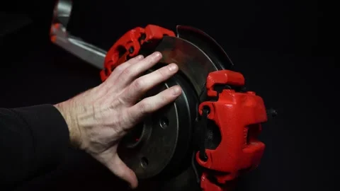 Disc brakes with two red calipers for hydraulic handbrake Stock Footage 302959710