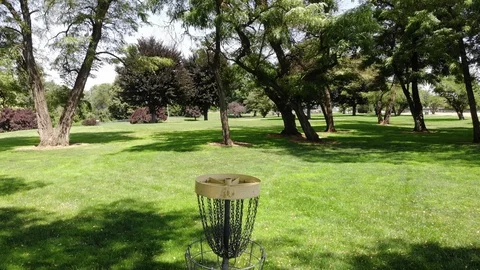 Disc golf basket on a disc golf course (4k) Stock Footage 113417147