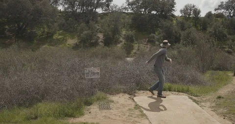 Disc golf drive off tee pad Stock Footage 104460465