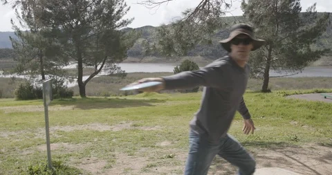 Disc golf drive on tee pad Video stock 104460485