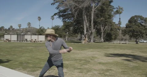Disc Golf practice high speed driver throw at park Stock Footage 103813904