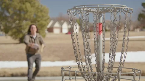 Disc Golf Putting and Making the Shot Stock Footage 170013252