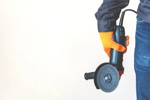 Disc grinder. Grinder in the hand. Close-up. Copy space Stock Photos