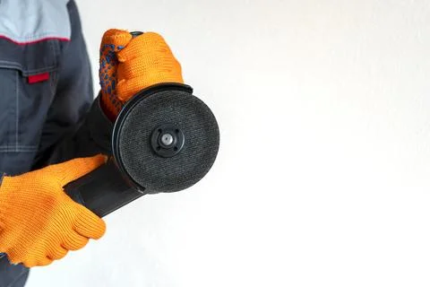 Disc grinder. Grinder in the hand. Close-up. Copy space Stock Photos