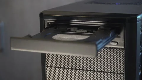 Disc is inserted into CD drive Stock Footage 169660933