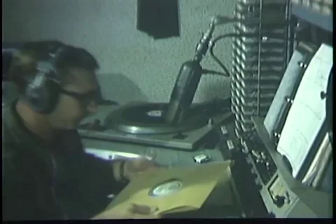 Disc jockey selects record and places it on turntable Stock Footage 93002464