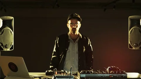 Disc Jockey Starting His Performance and Smiling Stock Footage 70930022