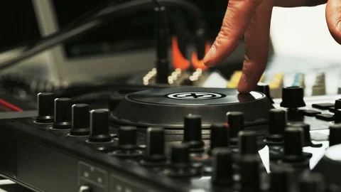 Disc Jockey's Hands and Face While He Changes Settings of the Sound Control Stock Footage 70935973