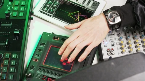 Disc Jockey's Hands Visible While He Changes Settings of the Sound Control Stock Footage 70929293
