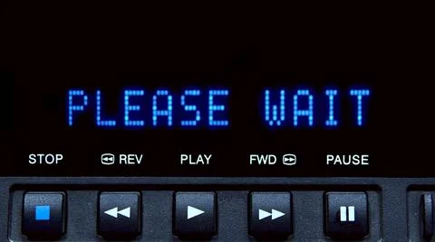 Disc player with screen. The word please wait is written on the screen. Stock Photos