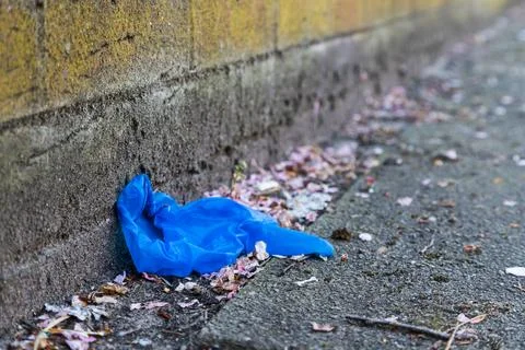 Discarded blue PPE Stock Photos