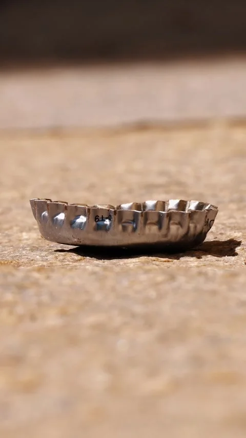 Discarded Bottle Cap on Urban Sidewalk. Detail of City Pollution Stock Footage 310405986