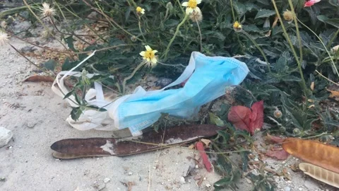A Discarded disposable face mask Stock Footage 131434156