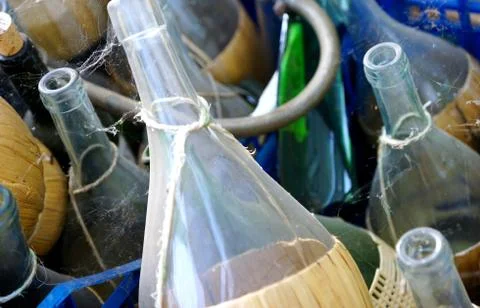 Discarded empty wine bottles Stock Photos