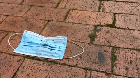 Discarded face mask on the floor Stock Footage 155548795