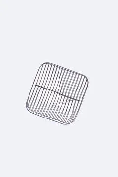 Discarded grill rack on solid white background Stock Photos