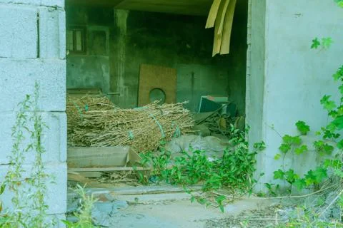 Discarded items inside abandoned building. Stock Photos