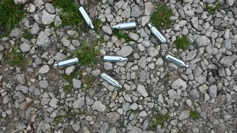 Discarded Nitrous oxide bottles Stock Footage 137017178