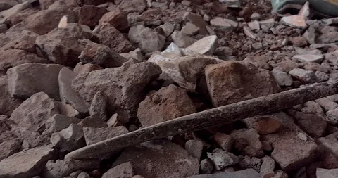 Discarded rusty iron point crow bar / pry bar / gunapam, concrete breaking Stock Footage 118431286