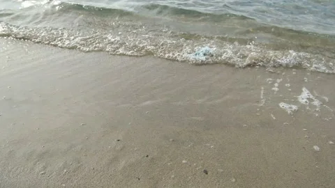 Discarded surgical face mask floating on sea ocean water waves,covid19 pollution Stock Footage 143292822