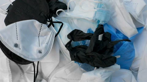 Discarded used protective face mask falling,hand sanitizer,covid19 pollution Stock Footage 161909428