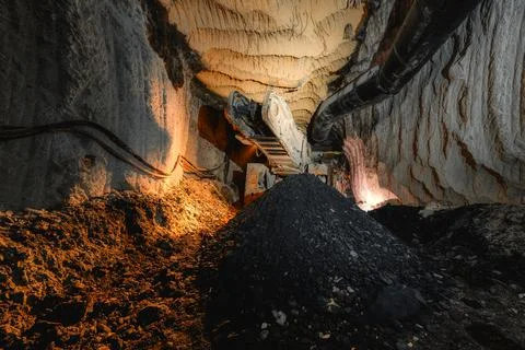 Discharge conveyor of a roadheader. Underground mining of ore deposits Stock Photos