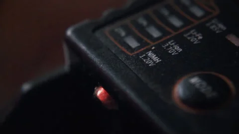 A discharged battery is inserted into the charge, close up Stock Footage 204954918